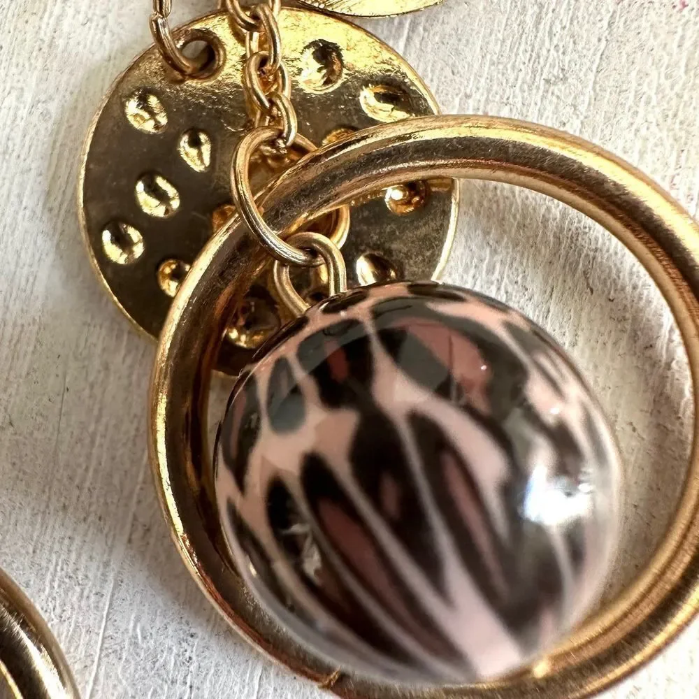 Gold tone charm drop earrings